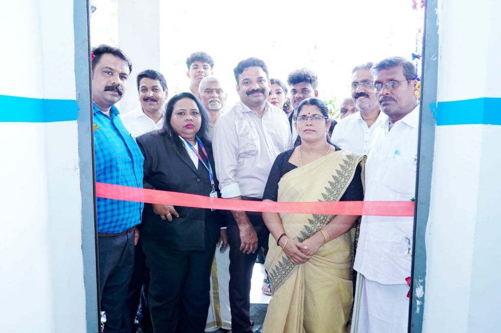 Kshemakrishi team members and dignitaries gathered behind a red ribbon for the official ribbon-cutting ceremony at the new Palakkad branch inauguration.