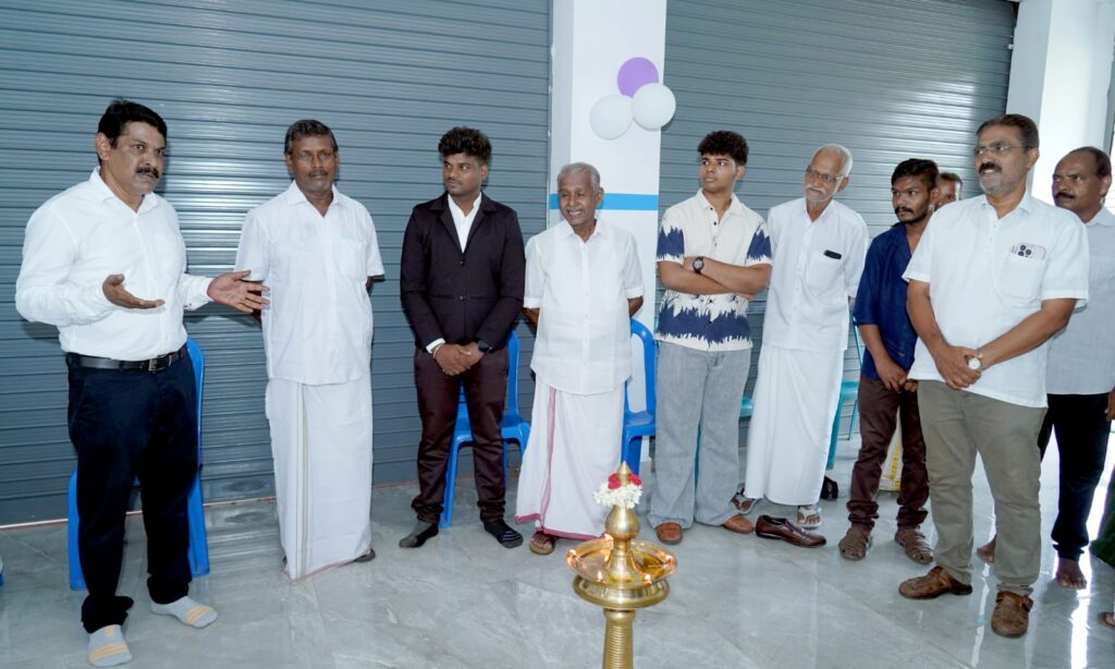 Dignitaries and staff lighting the traditional lamp (nilavilakku) at the grand opening of the Kshemakrishi new branch in Palakkad.